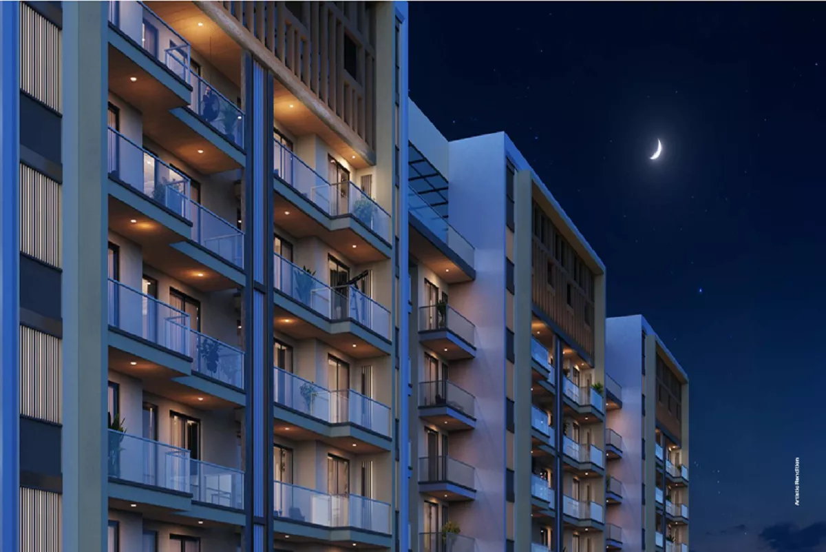 Satya Levante Residences Sector 104 Gurgaon showcasing elegant apartment balconies and modern exterior at night.